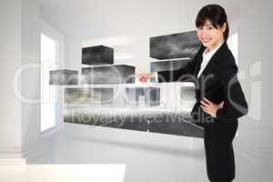 Composite image of smiling businesswoman pointing