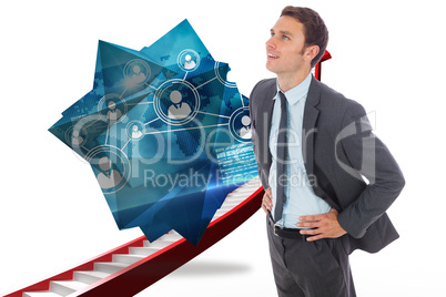 Composite image of cheerful businessman standing with hands on h