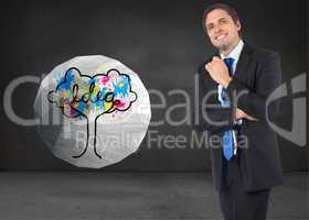 Composite image of thinking businessman holding pen