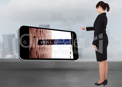 Composite image of businesswoman pointing