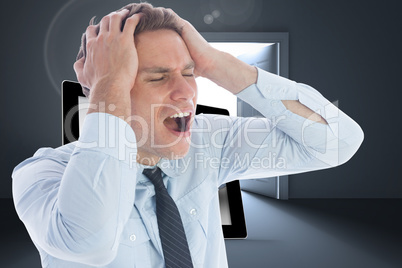 Composite image of stressed businessman with hands on head