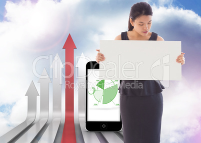 Composite image of businesswoman holding a placard