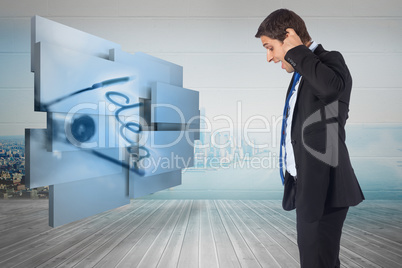 Composite image of thinking businessman scratching head