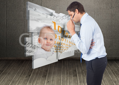 Composite image of thinking businessman holding pen