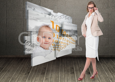 Composite image of severe pretty businesswoman looking at camera