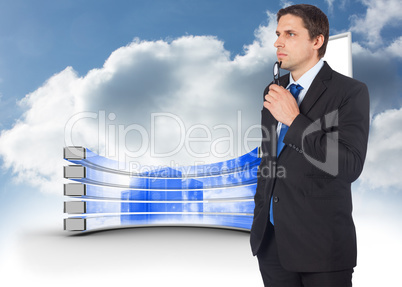 Composite image of thinking businessman holding glasses