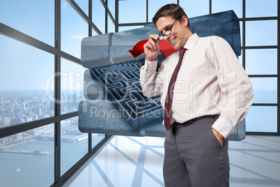 Composite image of thinking businessman touching his glasses