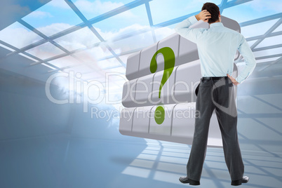 Composite image of thoughtful businessman with hand on head