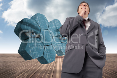 Composite image of thoughtful businessman with hand on chin