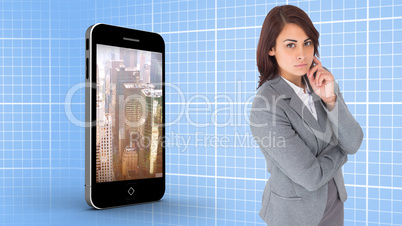 Composite image of focused businesswoman