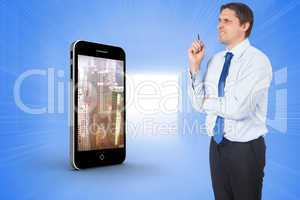 Composite image of thinking businessman holding pen