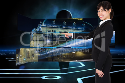 Composite image of smiling businesswoman pointing