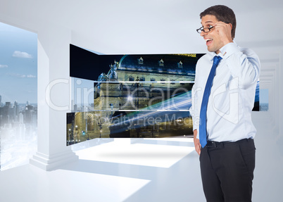 Composite image of thinking businessman tilting glasses