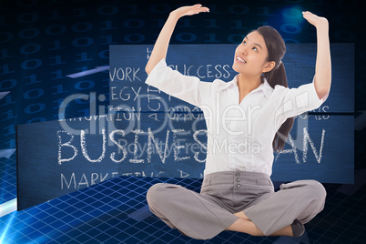 Composite image of businesswoman sitting cross legged pushing up