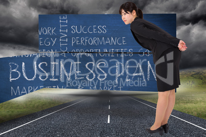 Composite image of serious businesswoman bending