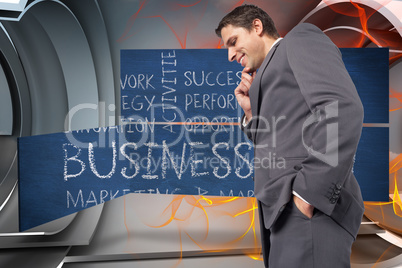 Composite image of thoughtful businessman with hand on chin