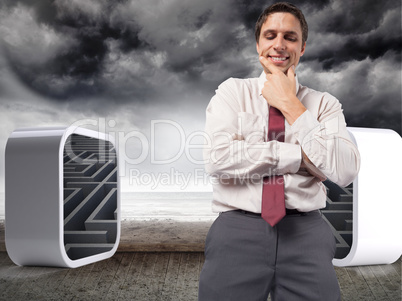 Composite image of thoughtful businessman with hand on chin