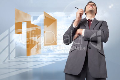 Composite image of thoughtful businessman holding pen