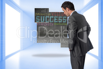 Composite image of serious businessman with hands on hips Composite image of serious businessman with hands on hips