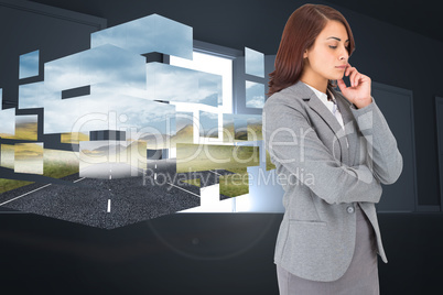 Composite image of concentrating businesswoman