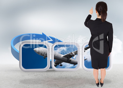 Composite image of businesswoman pointing