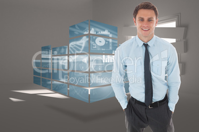 Composite image of happy businessman standing with hands in pock