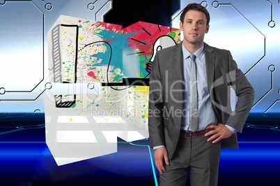 Composite image of serious businessman with hand on hip