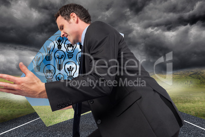 Composite image of businessman posing with arms out