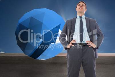 Composite image of happy businessman with hands on hips