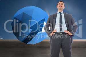 Composite image of happy businessman with hands on hips