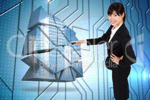 Composite image of smiling businesswoman pointing