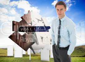 Composite image of serious businessman with hands in pockets
