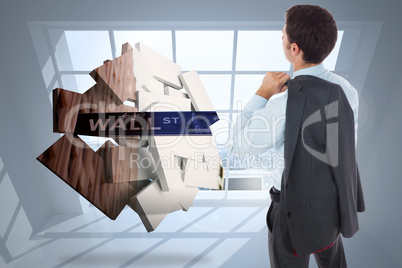 Composite image of businessman holding his jacket