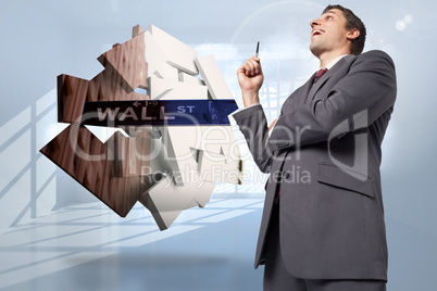 Composite image of thoughtful businessman holding pen