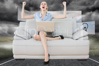 Composite image of cheering beautiful businesswoman sitting on c