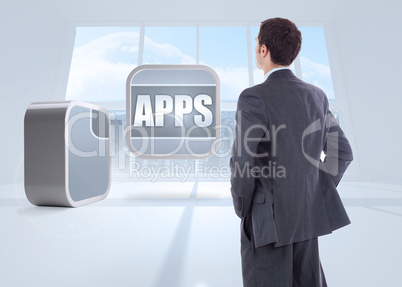 Composite image of businessman standing with hands on hips