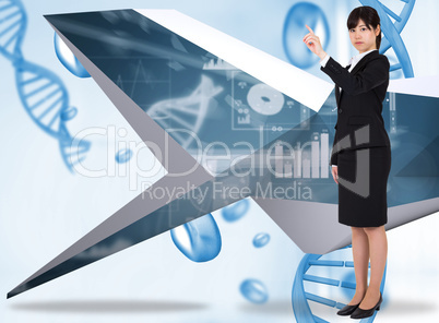 Composite image of focused businesswoman pointing