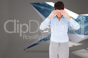 Composite image of businesswoman with her hands on her forehead