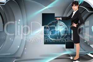 Composite image of focused businesswoman pointing