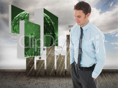 Composite image of happy businessman standing with hand in pocke