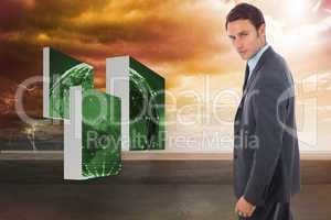 Composite image of serious handsome businessman standing