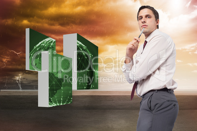 Composite image of thoughtful businessman holding pen to chin