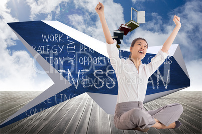 Composite image of businesswoman sitting cross legged cheering