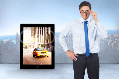 Composite image of thinking businessman tilting glasses