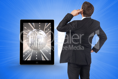 Composite image of thinking businessman scratching head