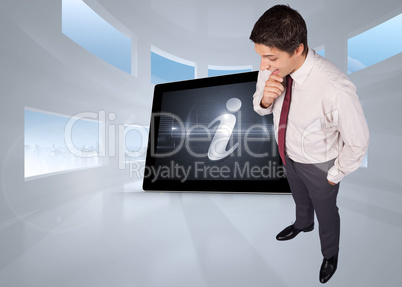 Composite image of thinking businessman touching his chin