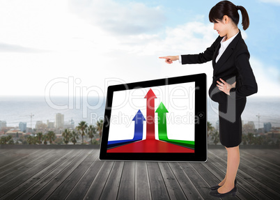 Composite image of businesswoman pointing