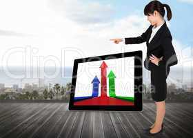 Composite image of businesswoman pointing