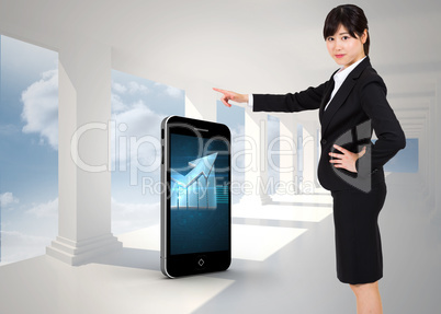 Composite image of businesswoman pointing