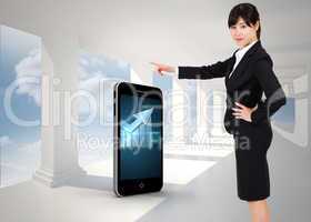 Composite image of businesswoman pointing